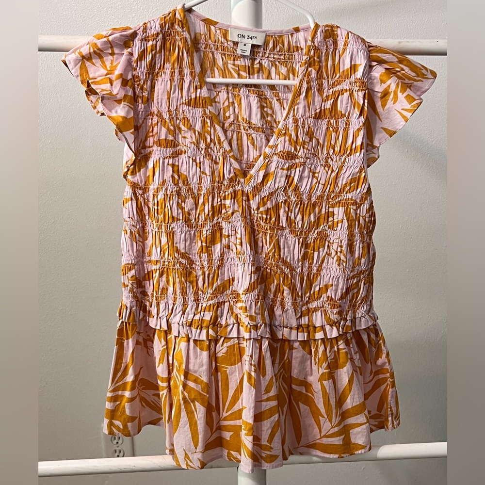 ON 34th Women’s smocked peplum flutter sleeve top light pink & orange